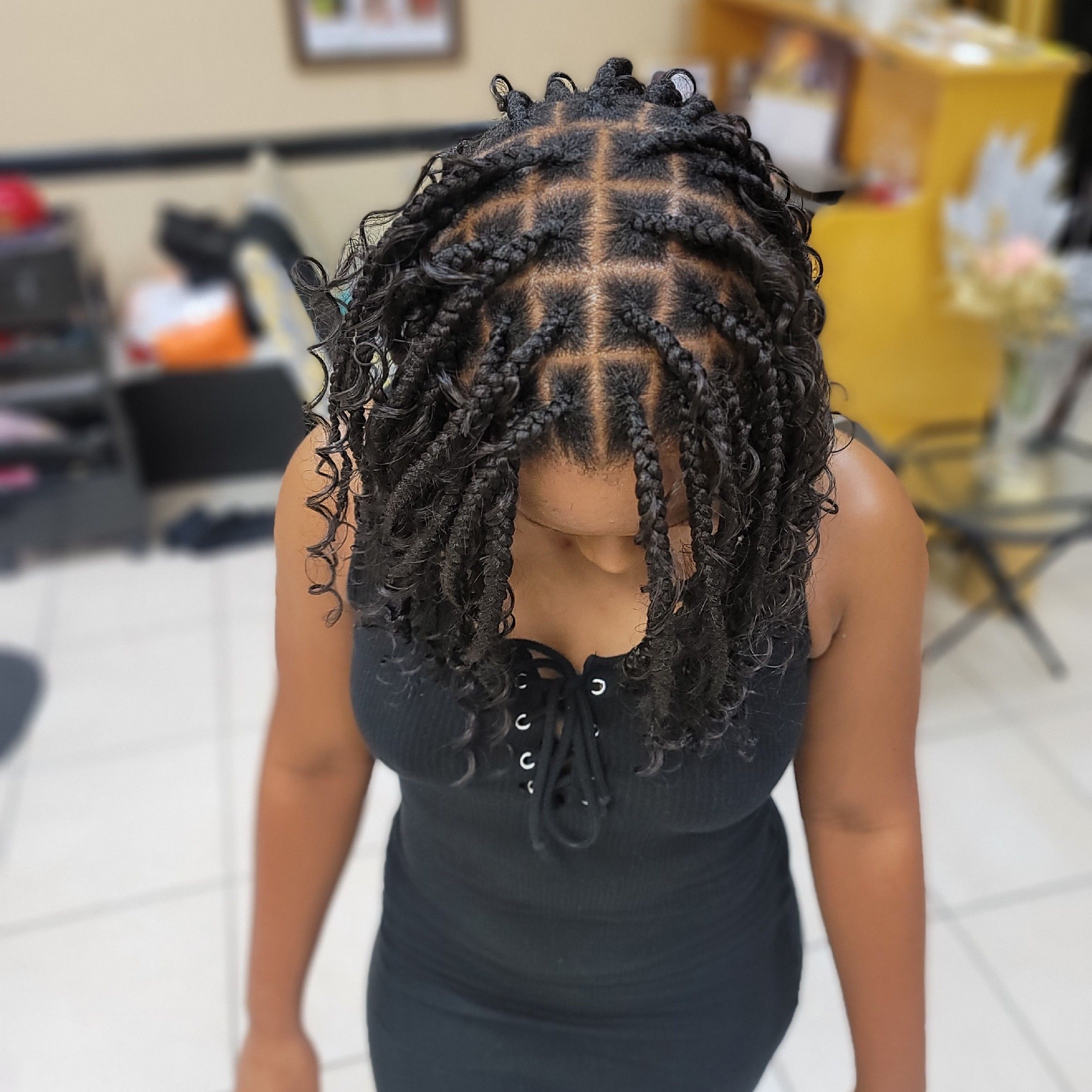 Box braids with curly ends